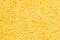 Yellow purified lentil closeup top view background.