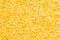 Yellow purified lentil closeup top view background.