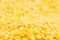 Yellow purified lentil macro background.