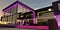 Yellow purple night illumination of the elite family house facade. View of the stylish relax zone. 3d rendering