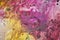 Yellow purple pink bright colors and hues. Abstract wet paint background. Painting spots.