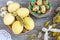 Yellow quail and chicken eggs for Easter on a handmade clay plate