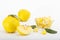 Yellow quince compote in a jar and a bowl on white background.