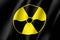 Yellow radiation sign on black background