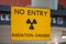 Yellow radiation warning and hazard sign forbidding entry to a radioactive zone