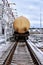 Yellow railroad tank cars for oil