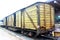 Yellow railway freight wooden wagon