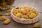 Yellow raisins in little rattan basket