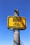 Yellow rectangle bicycle pathway sign with number and symbol on wooden pole