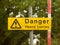 Yellow rectangle road sign on pole danger heavy lorries