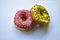 Yellow and red American delicious donut on a white background