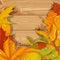 Yellow and red autumn leaves wooden background