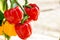 Yellow and red bell peppers with natural lights on blurred background