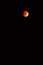 Yellow or red big moon on the dark black sky. Lunar skyscape, picturesque top view. Nature beauty, full moon time. Red moon. Orang