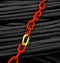 Yellow and red coloured metallic security lock chains photo