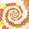 Yellow and red ecologic cherry tomatoes in mandala isolated in white background