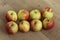 Yellow and red jonagold apples on wooden background