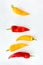 Yellow and Red Romano Peppers on Gray Background