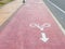 Yellow and red stone surface pavement background with bicycle lane