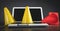 Yellow and red traffic cones on laptop keyboard