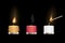 Yellow red and white aroma candles burning with matchstick