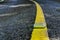 Yellow reflector line on road, traffic equipment background