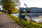 Yellow rental bike in the city. Sunset near the pond