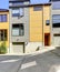 Yellow residential building with siding trim