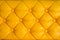 Yellow retro chesterfield style, capitone textile background
