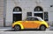 Yellow retro Volkswagen beetle car in in street