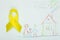 Yellow ribbon, Childhood Cancer Awareness Month. Children healthcare background with child`s drawing