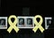 Yellow ribbon next to pictures of the catalan politics in jail since 2017 seen in Barcelona