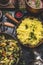 Yellow rice dish with stewed chopped cabbage and mushrooms on rustic kitchen background, top view.