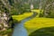 Yellow rice field on Ngo Dong river in Tam Coc Bich Dong from mountain top view in Ninh Binh, Viet Nam