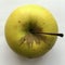 Yellow ripe apple top view. Abstract macro shot.