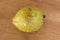 A Yellow Ripe Guavas On Board Surface
