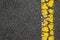 Yellow Road Marking Stripe On Asphalt Background
