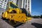 Yellow road roller works on construction site construction site