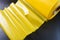 Yellow roll of polyethylene or polypropylene isolated on black