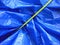 Yellow rope on blue tarpaulin