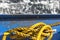 Yellow rope, or a mooring line on a ship. The colour contrast of blue and yellow is beautiful