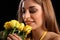 Yellow roses brings smile to young beautiful girl