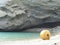 Yellow round marker in a beach of the island of Ponza in Italy.