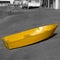 Yellow rowing boat near the marina