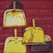 Yellow Rusty Dustpans Hanging on Red Wood