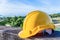 Yellow safety helmet on concrete