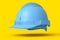 Yellow safety helmet or hard cap isolated on yellow monochrome background