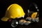 Yellow safety helmet , leather glove, head lamp, Headphone on black background