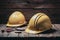 Yellow safety helmets prepared for workers, placed on wooden table