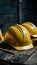 Yellow safety helmets prepared for workers, placed on wooden table